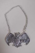 A silver plated brandy bottle label in the form of a bat, 8 x 5cms