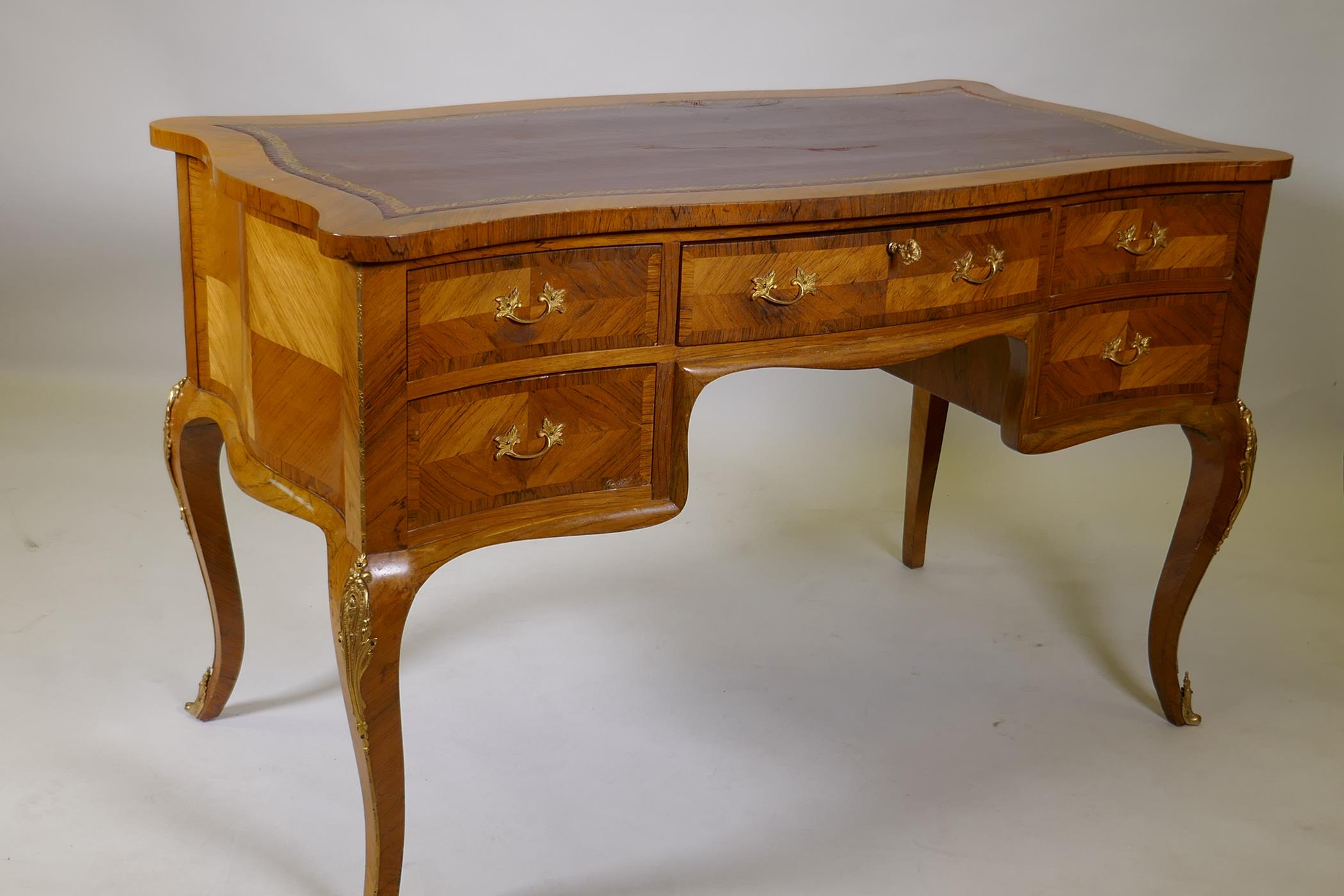 A French tulip wood and rosewood inlaid serpentine shaped five drawer kneehole desk, with gilt - Image 4 of 5