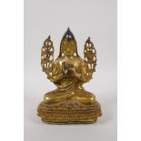 A Tibetan gilt bronze of Buddha seated on a lotus throne, 21cm high, impressed double vajra mark