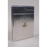 An Asprey & Co Ltd engine turned solid silver combination cigarette case and lighter, decorated with