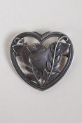A hallmarked silver Georg Jensen brooch in the form of a bird within a heart, London 1955, 16.5g