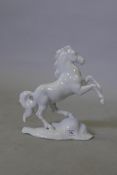 A Rosenthal porcelain figure of a rearing horse, impressed F. Heidenreich, 27cm high