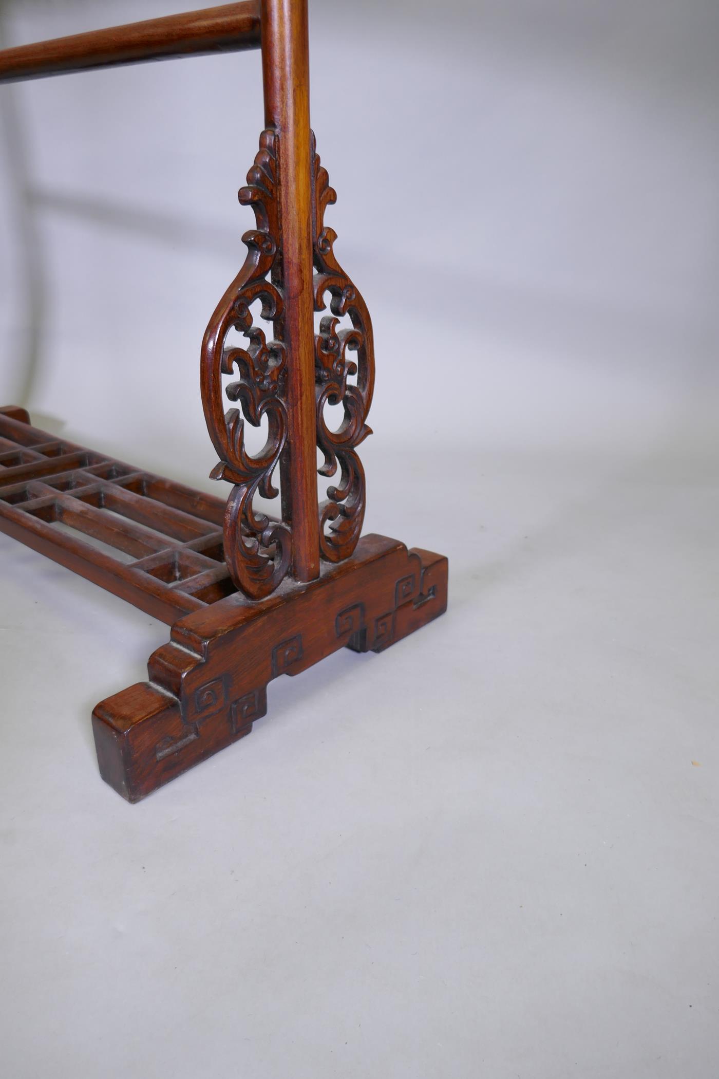 A Chinese carved wood robe rack with decorative pierced panels, 150cm high, 121cm wide - Image 4 of 5