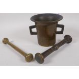 An antique bronze pestle and mortal, 13cm diameter, and another brass pestle