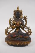 A Sino Tibetan gilt bronze of Buddha seated on a lotus throne, 21cm high