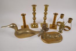 A quantity of brass candlesticks and figures etc, largest 20cm high