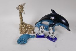 A Szeiler pottery figure of a baby giraffe, 22cm high, a Poole Pottery dolphin, seal and a small