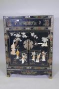 A Chinese lacquered cabinet, inlaid with mother of pearl and set with hardstone decoration, 77 x