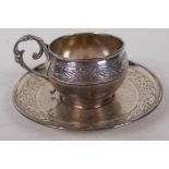 An antique French silver christening cup and saucer with delicate engraved decoration marked A Vague