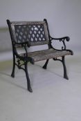 A wrought metal garden chair with slatted seat, 66cm wide x 80cm