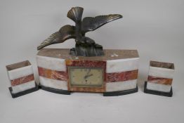An Art Deco three colour marble clock garniture, the clock surmounted by a spelter figure of a