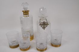 An etched and cut glass decanter and four matching tumblers, and a square cut glass decanter with