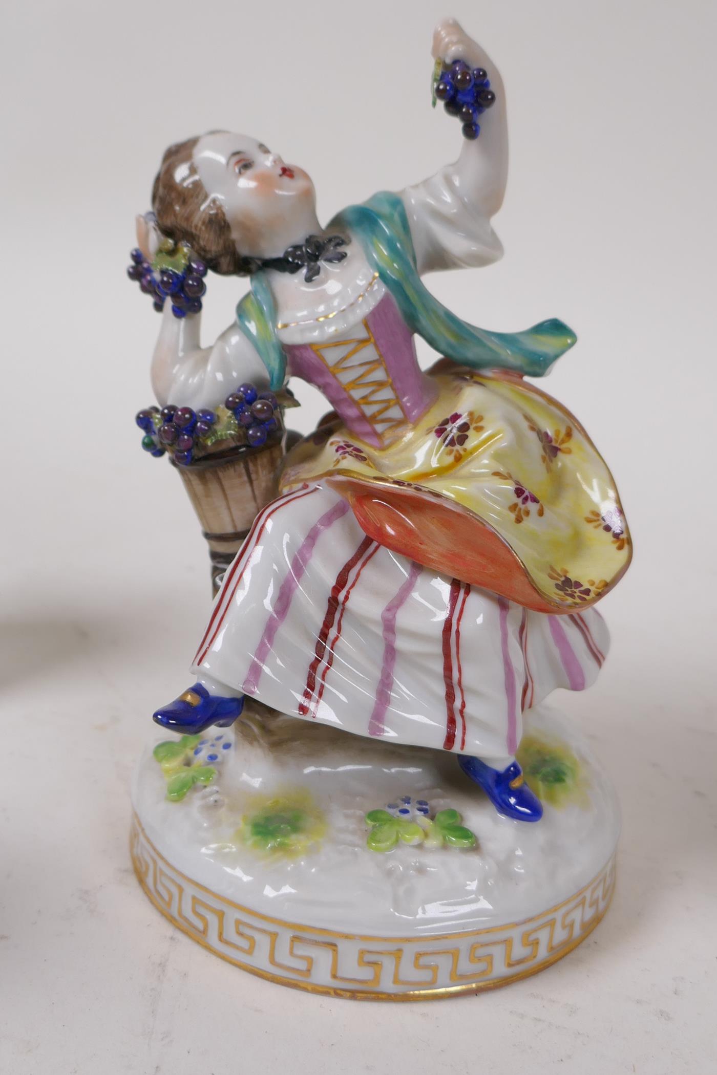 A C19th German porcelain figure of a girl with grapes, 13cm high, and four other continental - Image 4 of 6