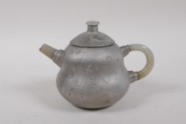 A Chinese Yixing tea pot with silvered glaze, and a jade handle and spout, 10cm high