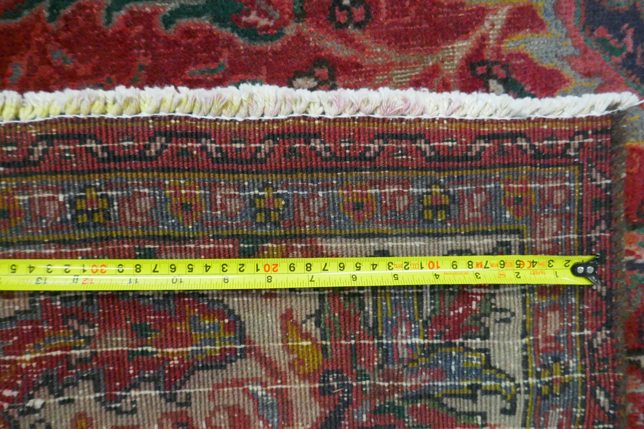 A Persian heavy pile red ground vintage Heriz carpet, Northern Iran tradition floral pattern, - Image 6 of 6