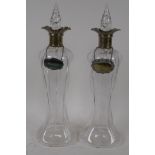 A pair of Art Nouveau glass decanters with hallmarked silver collars, Birmingham 1904, 35cm high,