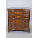 A Regency style mahogany bowfront chest, the brushing slide over four graduated drawers with handcut