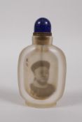 A Chinese reverse decorated glass snuff bottle depicting an emperor, inscription verso, 10cm high
