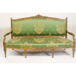 A C19th French style carved walnut settee, with shaped fronts, 180cm wide
