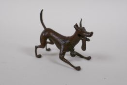 A Japanese bronze okimono of an animated dog, 7cm long