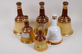 Six Bells ceramic whisky decanters, three Copeland, one Royal Doulton and two Wade