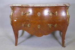 A French bombe shaped kingwood two drawer commode, with marble top and ormolu mounts, early C20th,