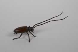 A Japanese bronze jizai style okimono beetle with articulated legs and antennae, 14cm long