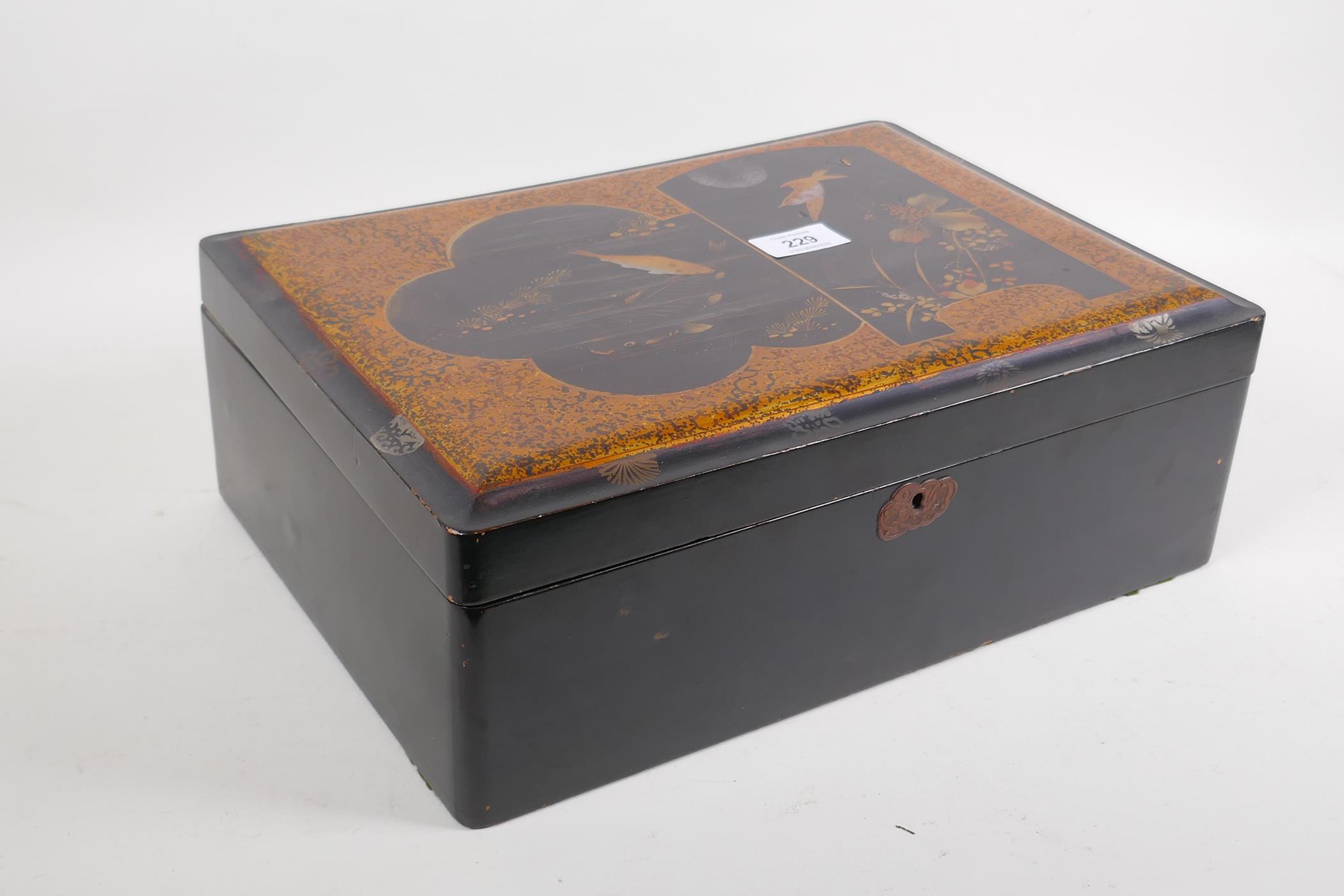 A Meiji lacquer box with gilt decoration of carp and a birds in a moonlit sky, 36 x 26 x 13 cm - Image 2 of 4