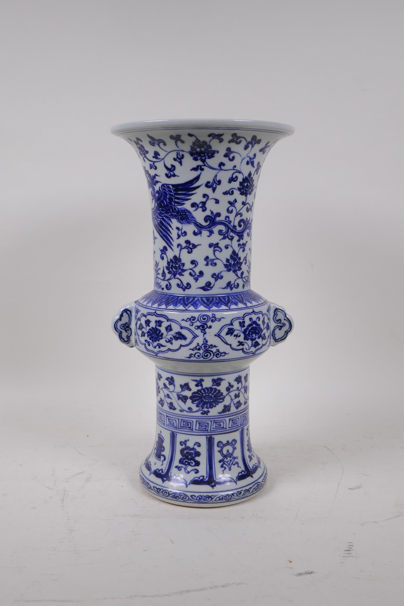 A Chinese Ming style blue and white porcelain gu shaped vase with two handles decorated with a - Image 3 of 6