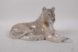 A Royal Copenhagen porcelain figure of a recumbent lioness, no 804, 31cm long