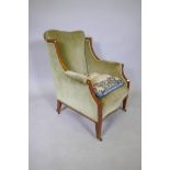 A C19th inlaid mahogany framed wing armchair with swept arms on square tapered supports and castors