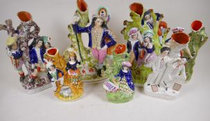 Seven Staffordshire flat back spill vases modelled as various figures