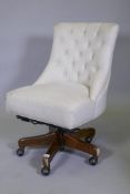 A Pottery Barn Hayes Tufted Swivel desk chair