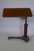 A C19th mahogany table with tilt and telescopic action, bears label Carters London, Invalid &