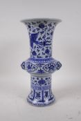 A Chinese Ming style blue and white porcelain gu shaped vase with two handles decorated with a