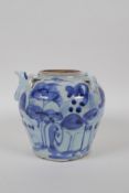 A C19th blue and white porcelain pourer with four lug handles, landscape decoration and character