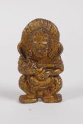 A Sino Tibetan gilt bronze figure of a wrathful deity, 6cm high