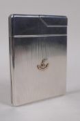 An Asprey & Co Ltd engine turned solid silver combination cigarette case and lighter, decorated with