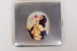 A hallmarked silver cigarette case with later applied enamel plaque of a female nude, Birmingham