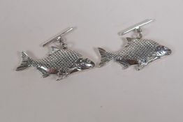 A pair of sterling silver carp cufflinks