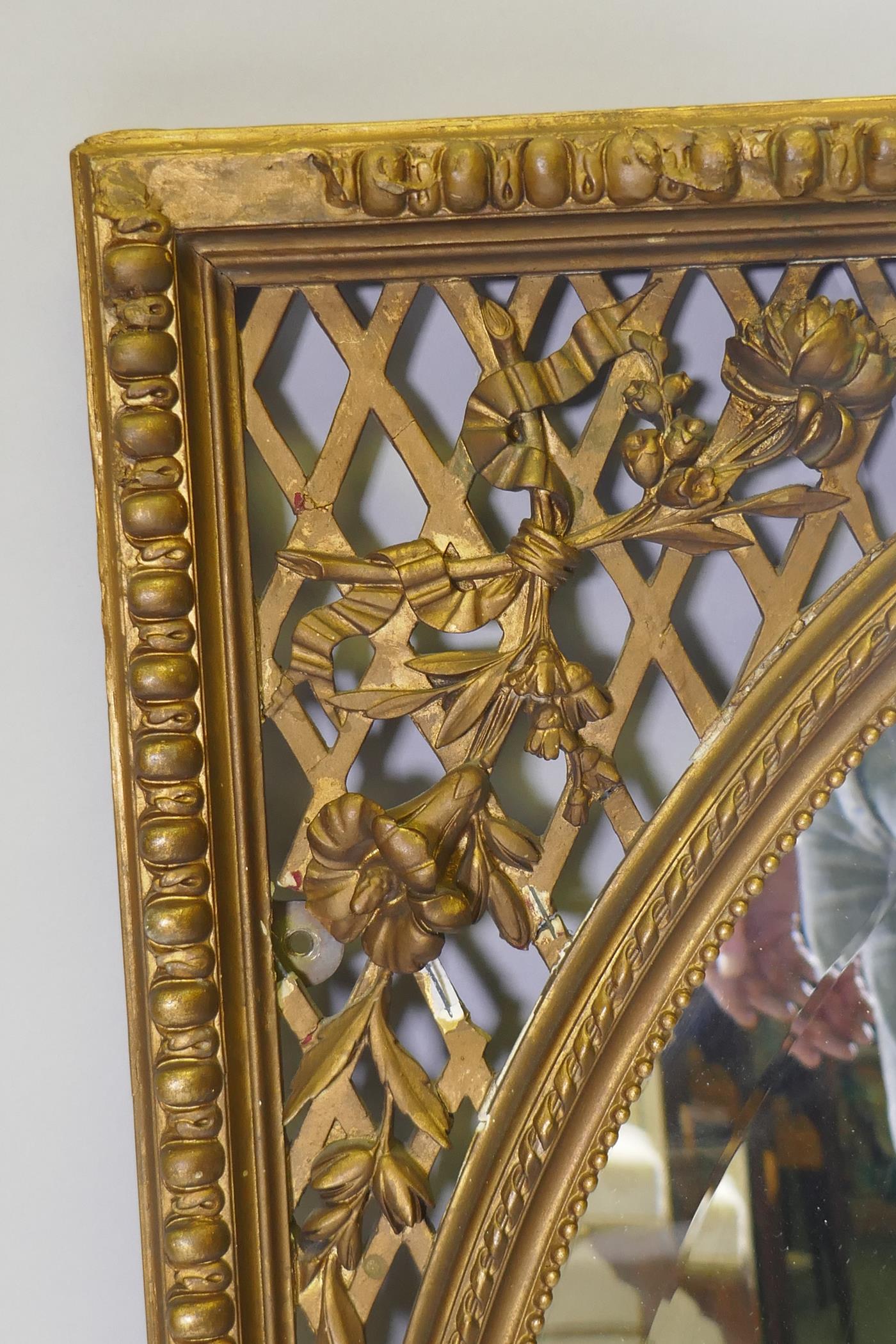 A C19th Continental giltwood and plaster wall mirror, with bevelled glass and pierced spandrels, - Image 2 of 4