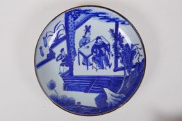 A blue and white porcelain dish decorated with figures in a garden, Chinese Kangxi 6 character