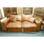 A leather two seater sofa bed, 200cm wide