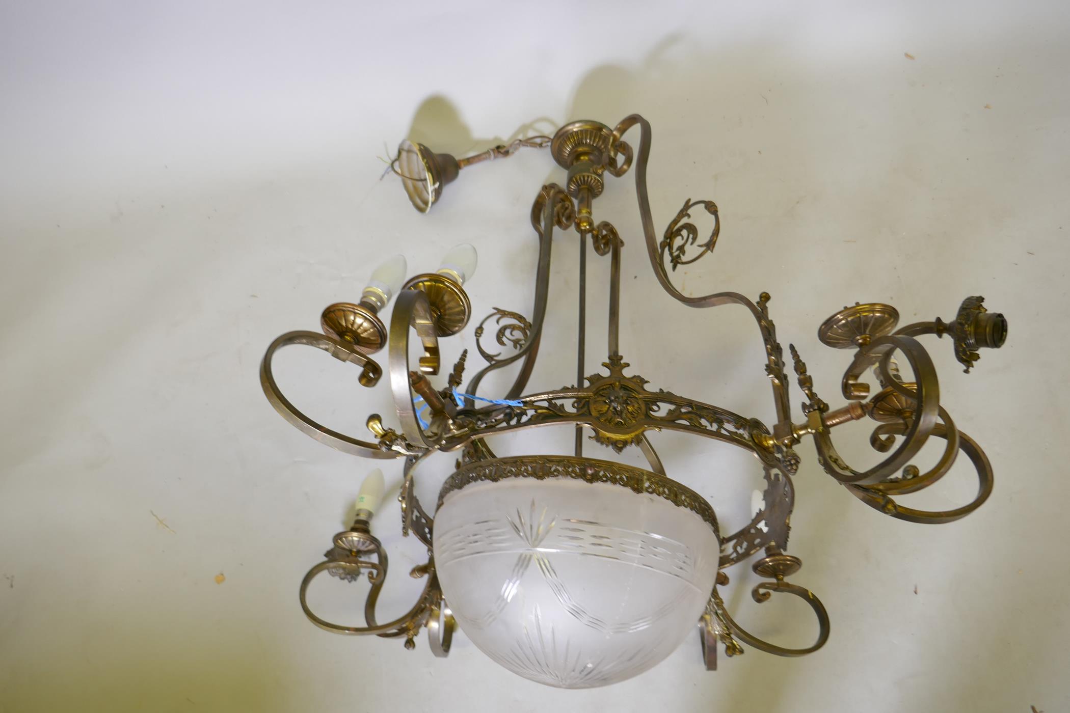 An early C20th bronze four branch, twelve lamp hanging ceiling lamp with etched and cut glass shade, - Image 2 of 4