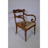 A Georgian style Anglo Indian mahogany carver chair with scroll arms and fluted turned supports