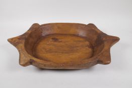 An Indian carved fruitwood chapati tray, 47 x 31cms