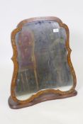 A C19th satinwood shaped easel mirror with painted decoration, mounted in a mahogany stand, 61 x