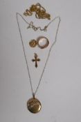A buckle ring, stamped DW, a gold crucifix and pendant, AF, and a locket