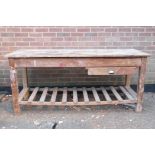 A pine work bench with a single drawer and slatted undertier, 184 x 67cms, 83cm high