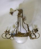 An early C20th bronze four branch, twelve lamp hanging ceiling lamp with etched and cut glass shade,